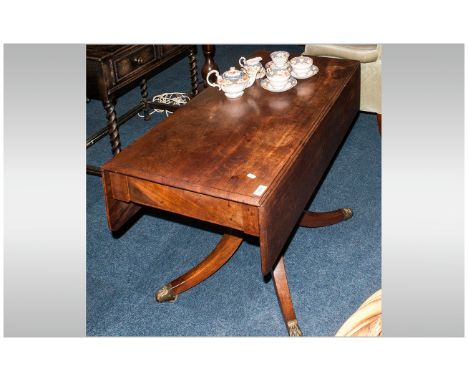 Regency Breakfast Table on brass claw castor feet. On tripod base. 39 inches wide, 28 inches high and 20 inches deep.