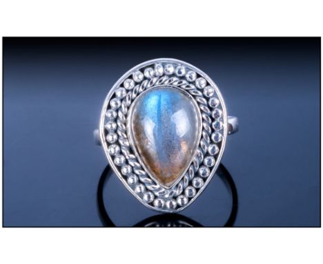 Hand Made Labradorite Ring, a pear cut cabochon of over 4cts, mounted in a silver bezel setting framed with a rope and row of