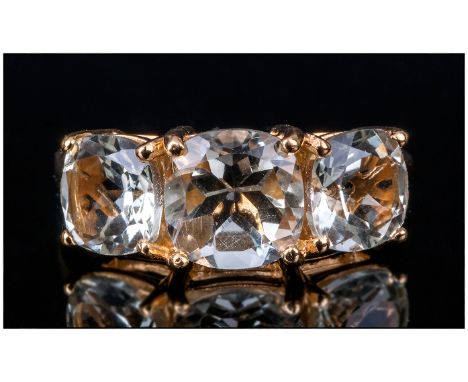 Green Amethyst Trilogy Ring, the centre cushion cut amethyst being 2cts, with a further cushion cut 1.25cts to either side, s