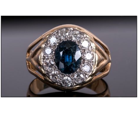 18ct Gold Set Diamond & Sapphire Cluster Ring The Central Sapphire Surrounded by 12 Diamonds of good colour. 1.2cts.