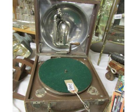 A 1920's Decca 'Trench' portable gramaphone featuring internal aluminium speaker and winding handle, a/f.