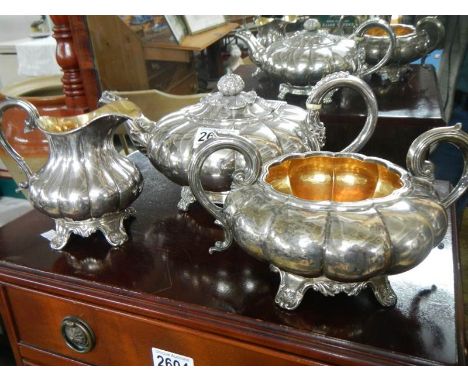 A Victorian 3 piece silver plate tea set with gilt interior.