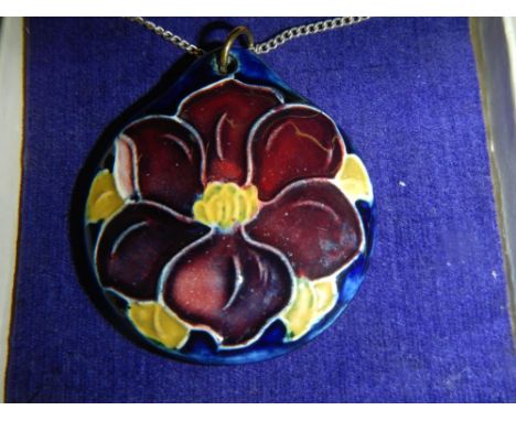 An original Moorcroft pendant attached silver chain, in box.