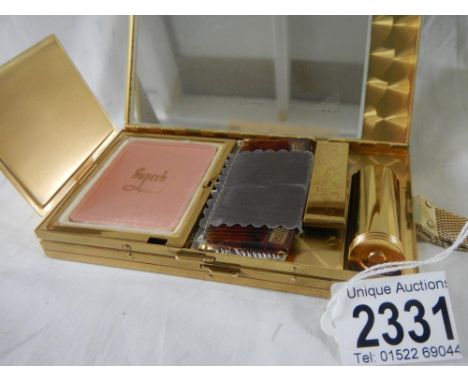 A vintage 1940's quality ladies travel concertina make up case, wrist strap, 2 compartments in fine finished gold coloured go