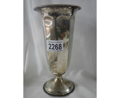 A hall marked silver spill vase and fair condition, 7.75" tall.