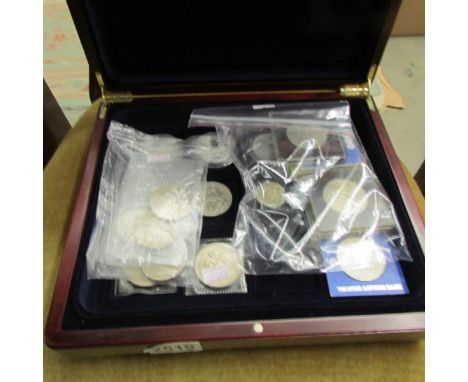 A case containing 4 silver Elizabeth II proof coins, 4 x £5 coins, other crowns etc.,