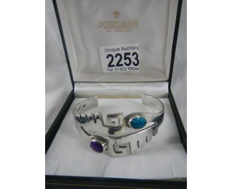 A silver bracelet marked 925