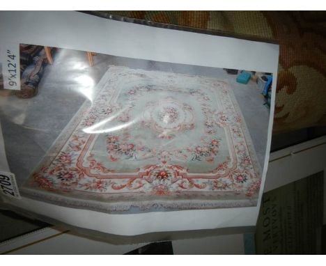 A large washed Chinese carpet, approximately 9' x 12'4''.