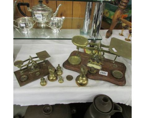 2 sets of postal scales and a quantity of weights.