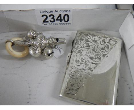 A silver cigarette case and a hall marked silver metal babies rattle.