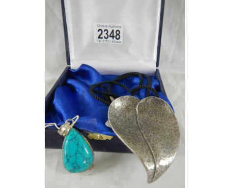 A Delphone Norden designer necklace and a silver necklace.