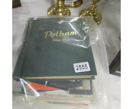 A stamp album with stamps including Victorian penny reds, some presentation packs, first day covers etc.,