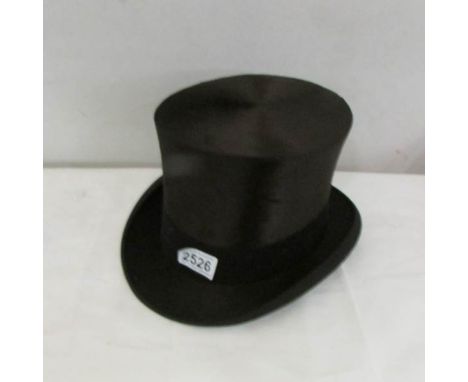A vintage top hat marked 'Best Quality, London@.
