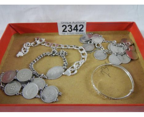 A mixed lot of silver including coin bracelets, chain, childs bracelet etc., approximately 62 grams.