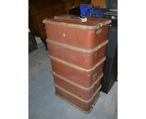 An old canvas covered trunk with wooden bindings.