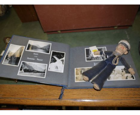 An album of photo's and ephemera re: R M S... "Orontes" and a Nora Wellings rag doll sailor; and an "Orontes" cap band.