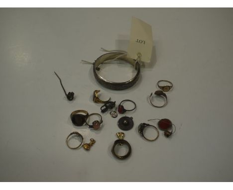 A silver bangle; sundry decorative rings; other items of jewellery.