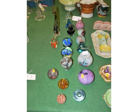A collection of glass paperweights by Mdina; a Caithness glass; glass bowl signed Nigel Morton 1988; other paperweights and S