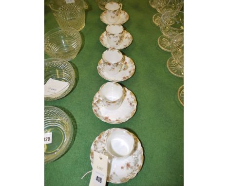 A set of five French bone china coffee cans and saucers, by H. & Co., France, with floral and gilded decoration.