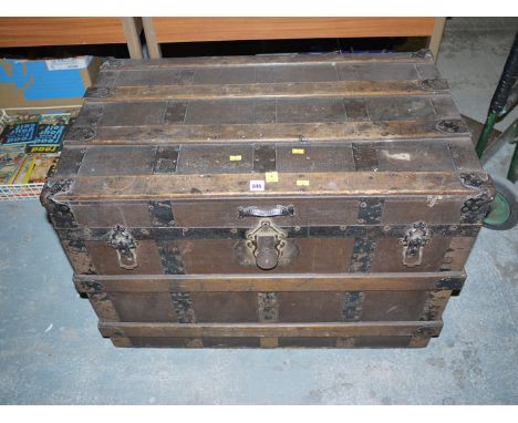 A 19th Century cabin trunk with metal bindings.