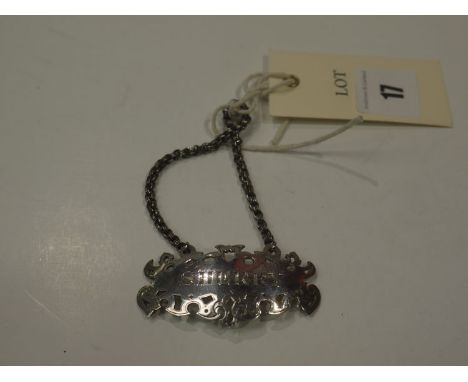 A Victorian silver decanter label by C.R.G.S. London 1847 of shaped pierced form and engraved 'Sherry', on a triple link chai