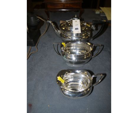 An early 20th Century three-piece oval plated tea service, comprising: tea pot, sugar bowl and milk jug.