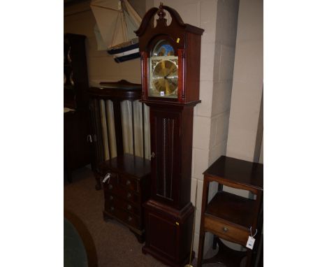 A reproduction grandmother clock, with arched moon phase dial and roman numerals on gold coloured metal face, the mahogany tr