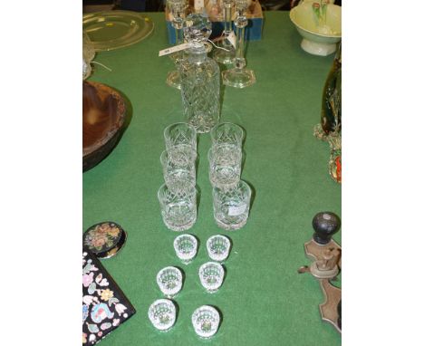 A cylindrical cut glass decanter and stopper; a set of six matching tumblers; and a set of six small liqueur glasses.