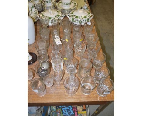 A collection of 19th Century and early 20th Century drinking glasses, comprising: tumblers; a pair of small condiment decante