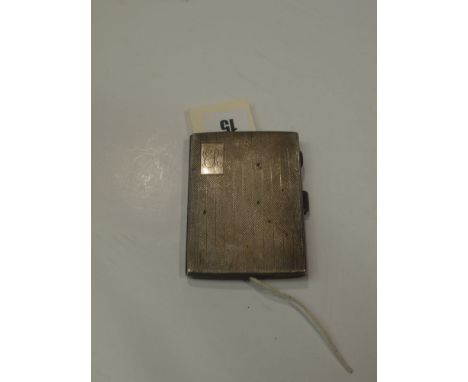 A silver cigarette case with engine turned decoration with engraved initials E.R.