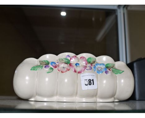 A 1930's Clarice Cliff design posy bowl with raised hand-painted floral decoration on cream coloured ground, the base with bl