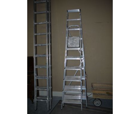 A tall aluminium folding step ladder; and another.