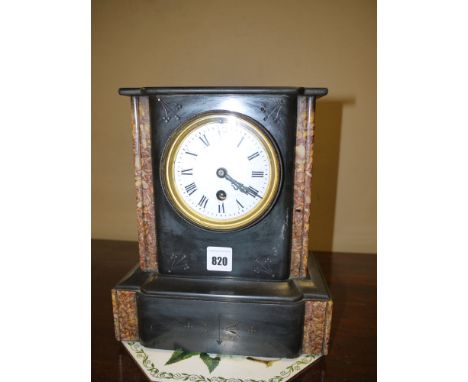 A Victorian mantel clock in polished slate and marble case, the circular white enamel dial with roman numerals.