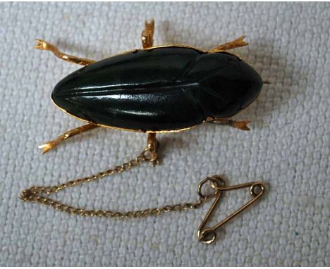 A mid-20th century Ladies Brooch, yellow metal and green jade (tested as 9ct minimum), fashioned as a Beetle, 35mm long, 12.5