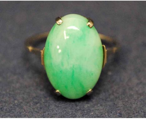 A 9ct white gold and jade Dress Ring, the single oval stone, pale green in colour, set in four claw oval mount, ring size S 1