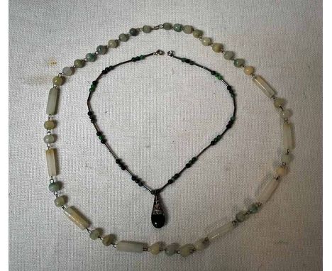 A white jade Necklace with green graduations of tube and ball form on white metal wirework links 69cm long and another green 