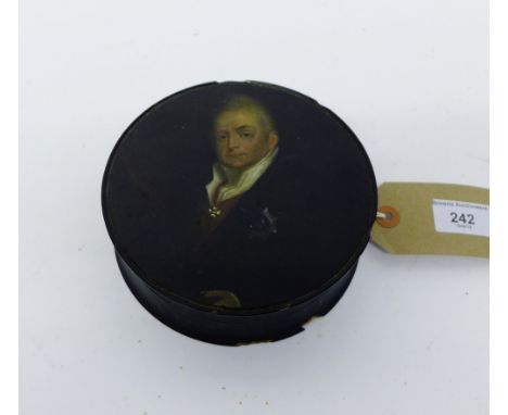 An Early 19th Century large ebonised pair mache circular snuff box, the cover depicting William IV 15 x 5cm 