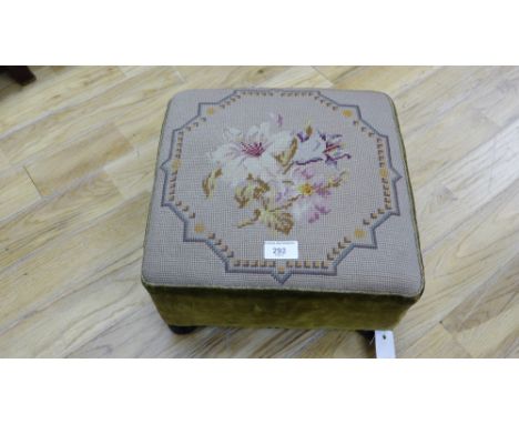 A mahogany framed footstool having a tapestry top, raised on bun feet, 