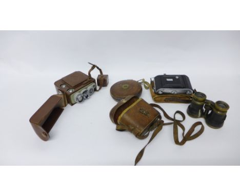 A box containing various vintage items to include Ensign Camera, measuring tape, field glasses, etc (a lot) 
