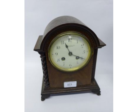 A late Victorian mahogany dome topped mantle clock, the dial inscribed James Hardy & Co, Edinburgh, raised on carved feet, 19