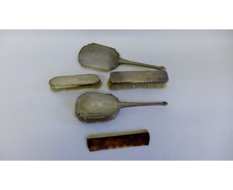 Silver backed dressing table brush set to include a hairbrush, two clothes brushes, comb and a hand mirror (5) 