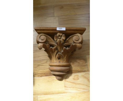 A carved pine scrolling foliate wall bracket shelf.  74 x 26cm