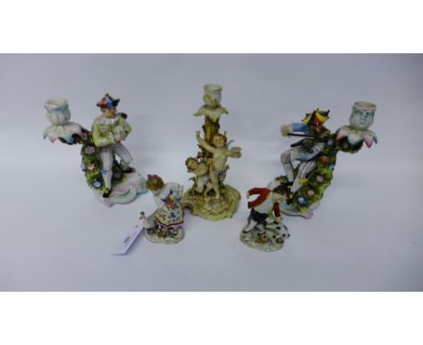 Rudolstadt Volkstedt porcelain cherub candlestick together with continental porcelain candlesticks and a pair of boy and girl