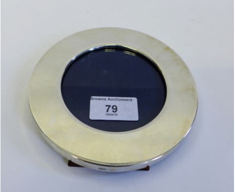 A contemporary 925 silver framed circular photograph frame, with easel strut back, 14 x 14cm