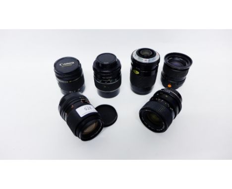 A collection of six various camera lenses to include Canon and Sigma Zoom etc 
