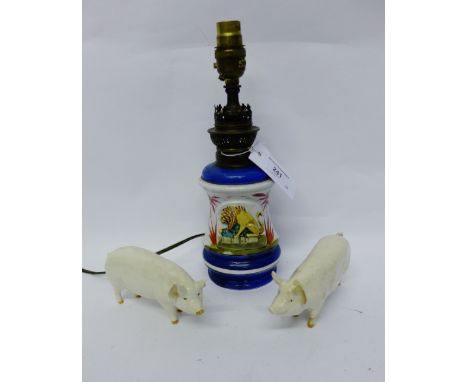 A ceramic table lamp and two Beswick pigs (3) (a/f) 