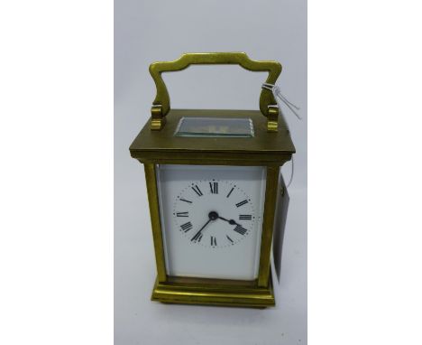 Brass cased carriage clock, the white enamel dial with Roman numerals, 12cm high 