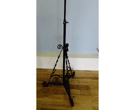 A cast iron adjustable standard lamp, 157cm high