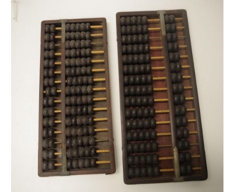 Two Chinese wood framed abacus each wood framed with brass bindings, (width 39cm; &amp; 42cm approx).