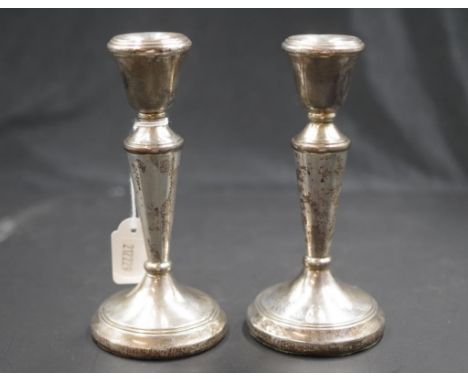 Pair Elizabeth II sterling silver candlesticks Birmingham 1986, makers Whitehill Silver &amp; Plate, weighted bases, (height 